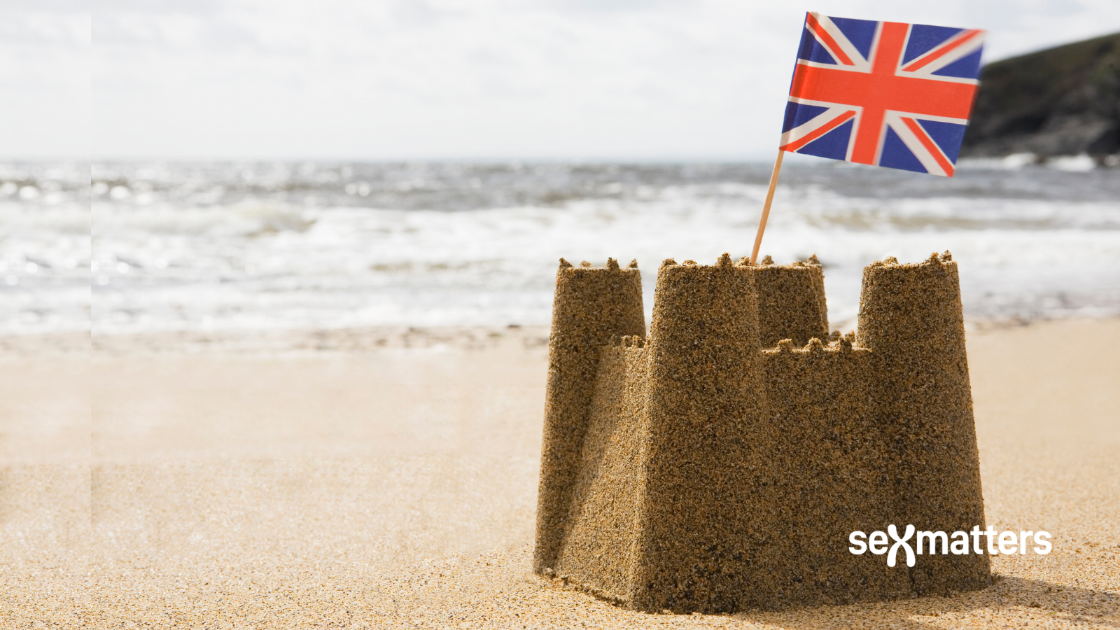 Sandcastle planted with Union flag.