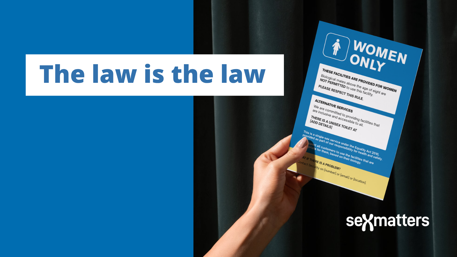 The law is the law - hand holds "women only" sign