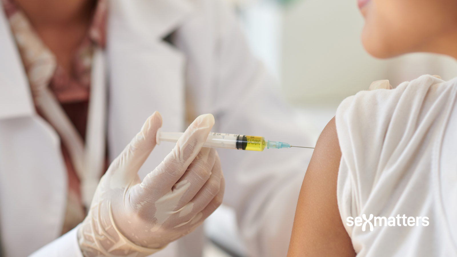 Doctor injecting child