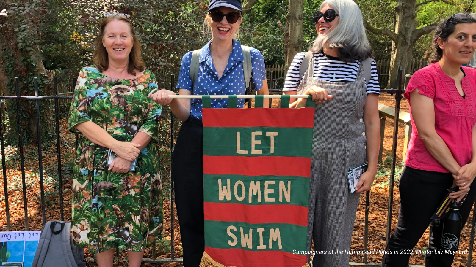 Women at Hampstead Ponds hold a "Let Women Swim" banner